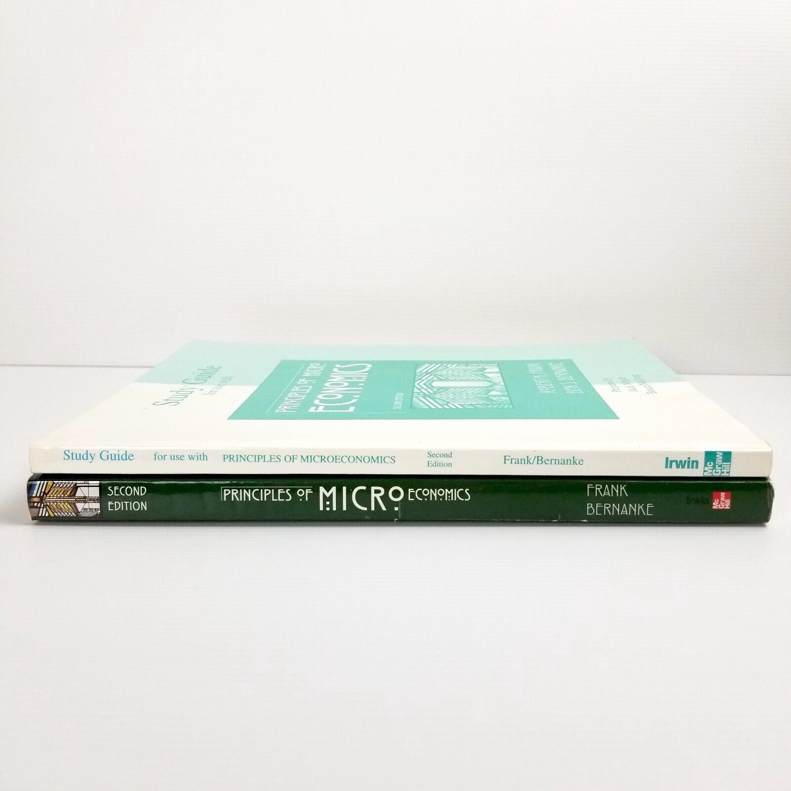 2x Textbooks Principles of Microeconomics by Robert H. Frank and Ben Bernanke